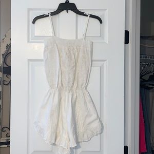 White embroidered ruffled romper